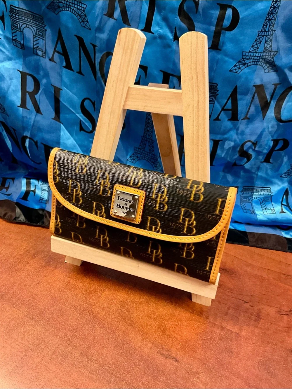 Dooney & Bourke Black Wallet with Yellow Trim and Logo Plaque